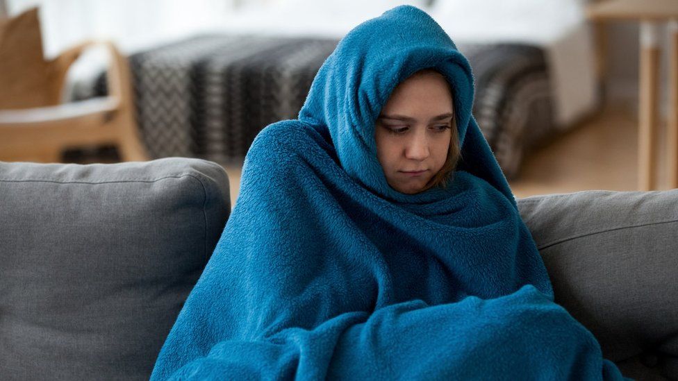 Woman wrapped in a blanket