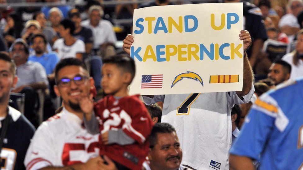 A San Diego Chargers fan holds up a sign in reference to San Francisco 49ers quarterback Colin Kaepernick (not pictured) during the first half of the game at Qualcomm Stadium on 1 September