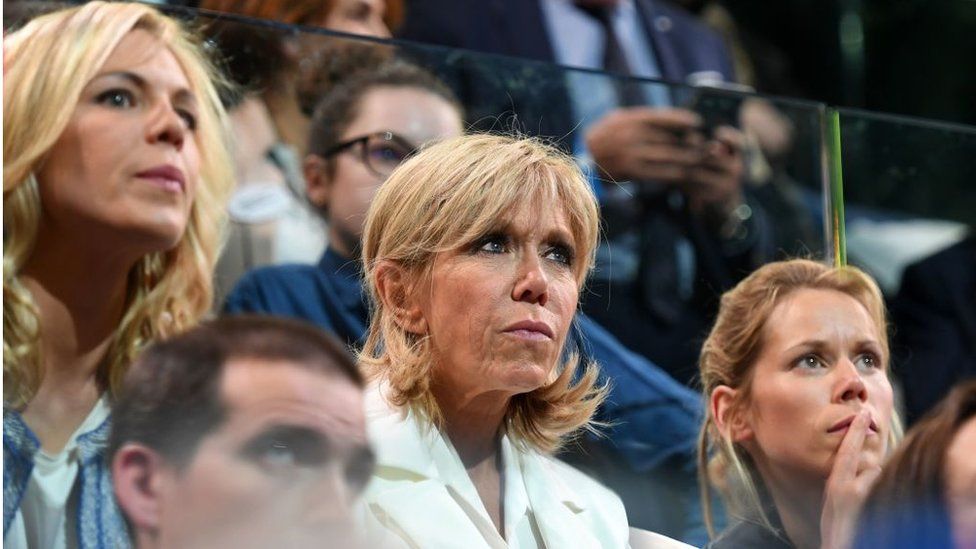 Brigitte Macron (C) and her daughters Tiphaine Auziere (R) and Laurence Auziere-Jourdan (L) attend a campaign event on April 17, 2017 at the Bercy Arena in Paris.