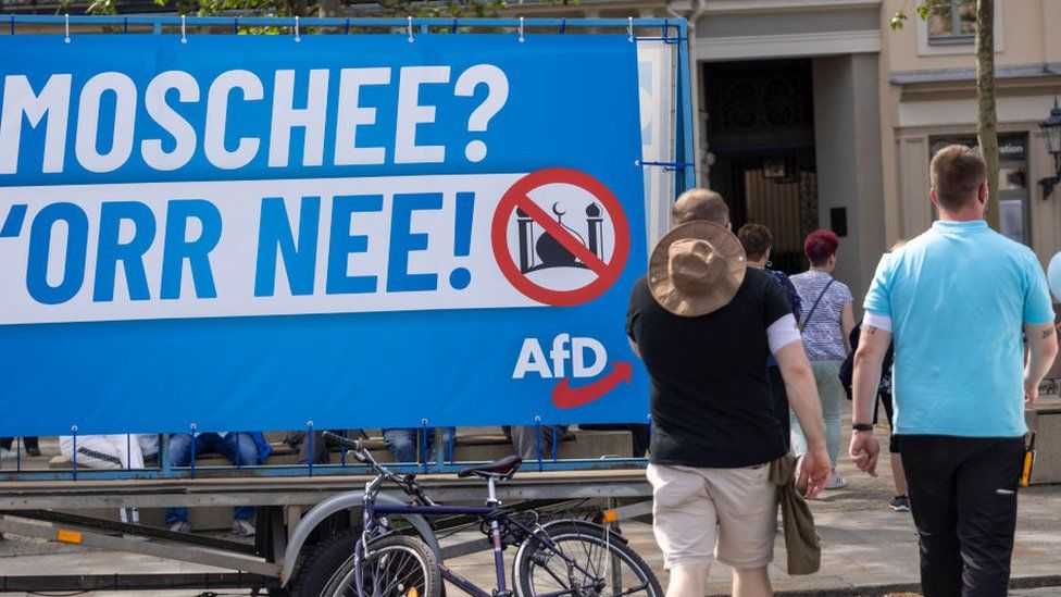 A banner reads "Mosque or No!" as supporters of the far-right Alternative for Germany (AfD) political party, attend the AfD's May Day family fest on May 01, 2024 in Dresden, Germany