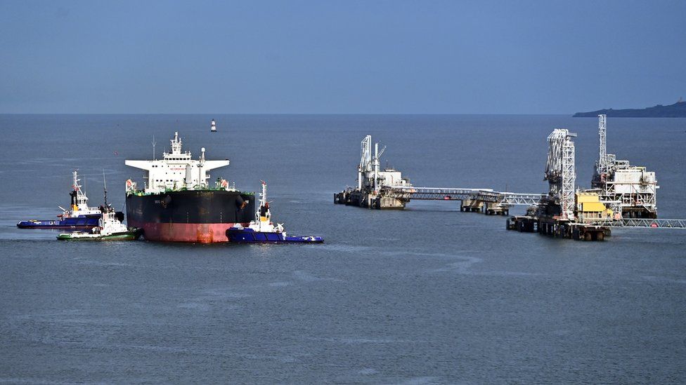 The Bahamas-registered crude oil tanker "Sword" berths at Hound Point Oil Terminal in the Firth of Forth, assisted by tugs, on September 22, 2022, in South Queensferry, Scotland.