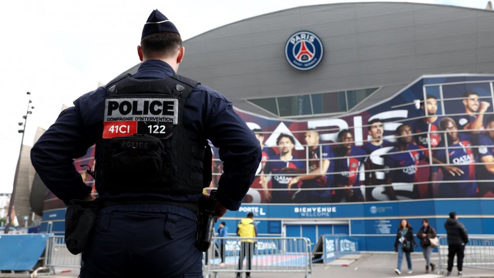 A French police officer outside PSG's stadium