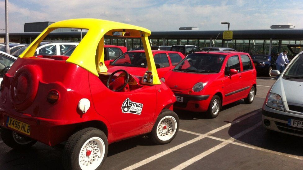Adult-sized Little Tike in car park