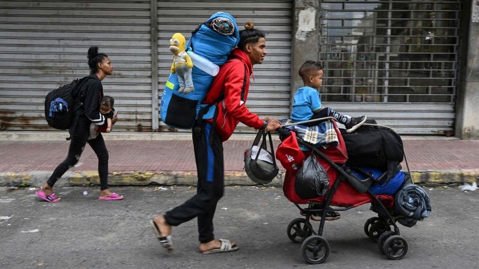 A Venezuelan family heads to the Temporary Housing Center for Migrants San Antonio Casa Esperanza after walking for weeks in order to cross into Colombia and continue their journey to the United States, in San Antonio del Tachira, Venezuela, on September 25, 2022.