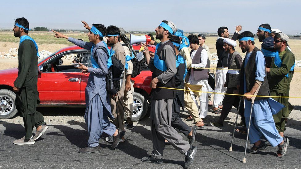 This picture taken on June 8, 2018 shows Afghan peace activists shouting slogans in demand to an end to the war