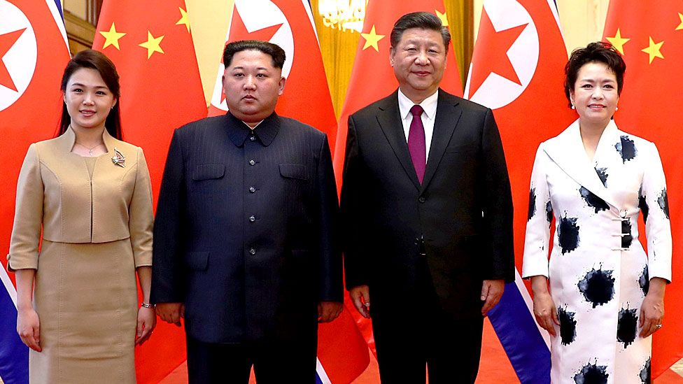 North Korean leader Kim Jong Un and wife Ri Sol Ju pose for a picture with Chinese President Xi Jinping and wife Peng Liyuan at the Great Hall of the People in Beijing