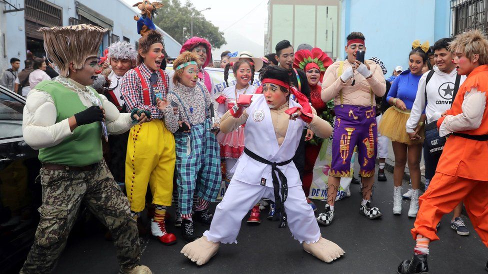 Clowns take part in a parade during Peru's Clown Day celebrations in Lima, Peru May 25, 2018