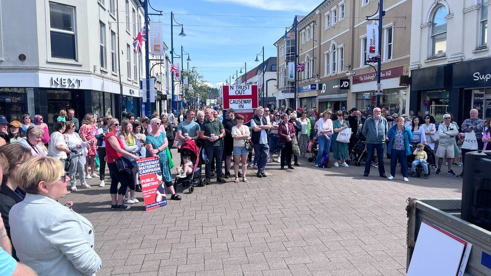 About 100 people gathered in the town centre