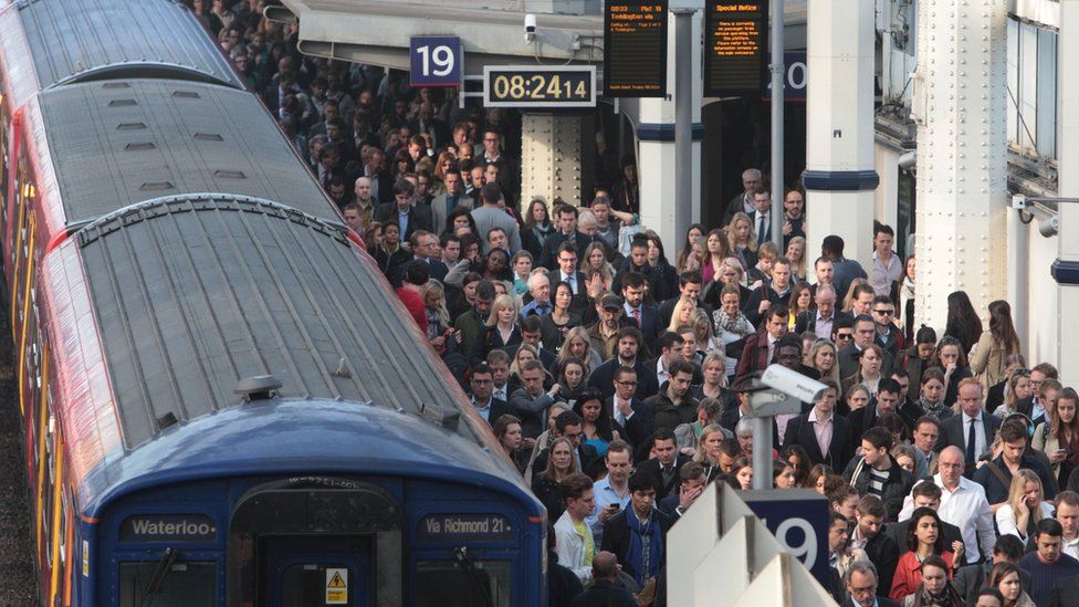 File photo of commuters waiting to pass through the barriers at Waterloo station during the tube strike