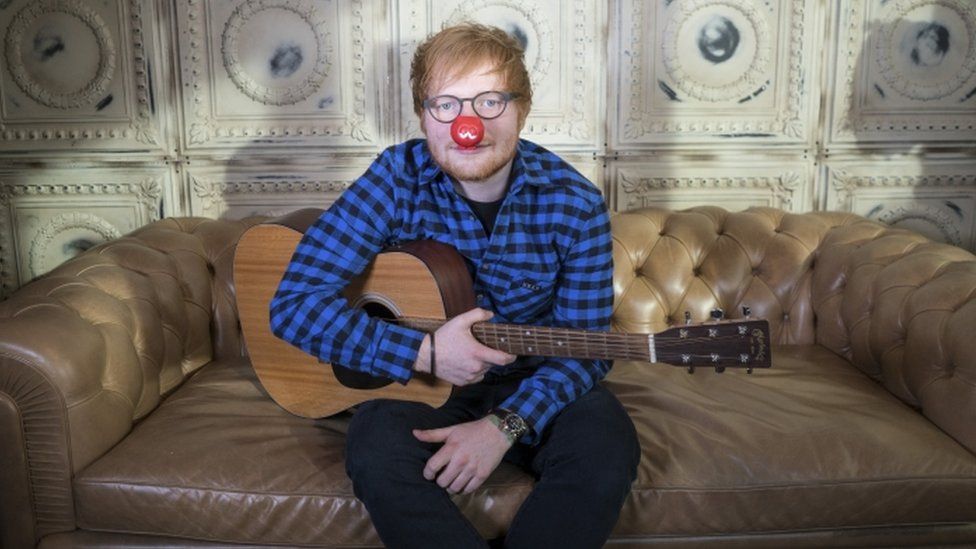 Ed Sheeran wears a red nose