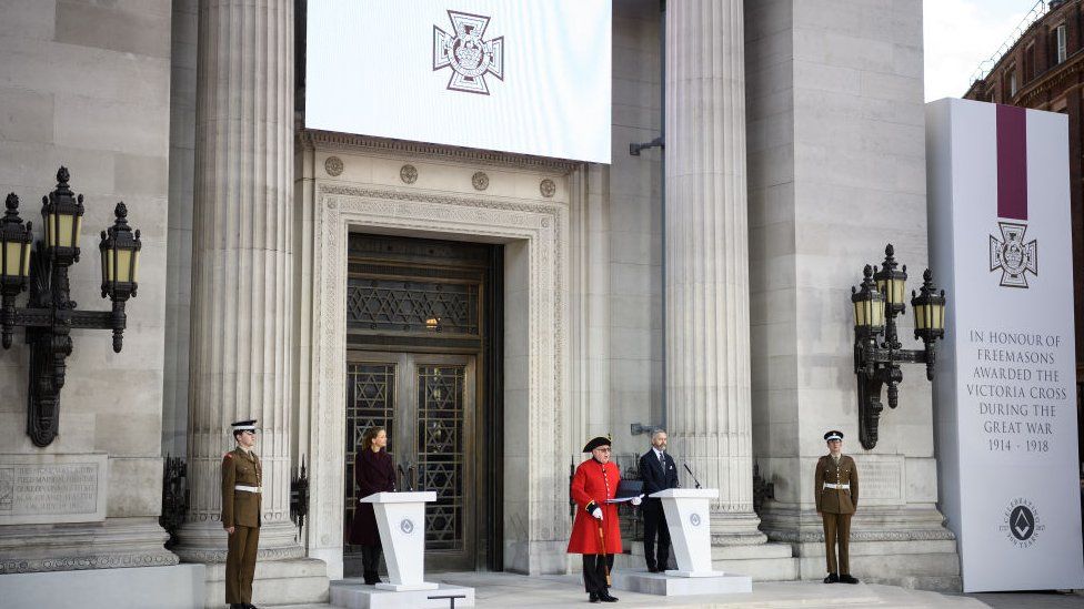 A monument commemorating those who were awarded the Victoria Cross medal is unveiled outside the Freemasons' Hall in London