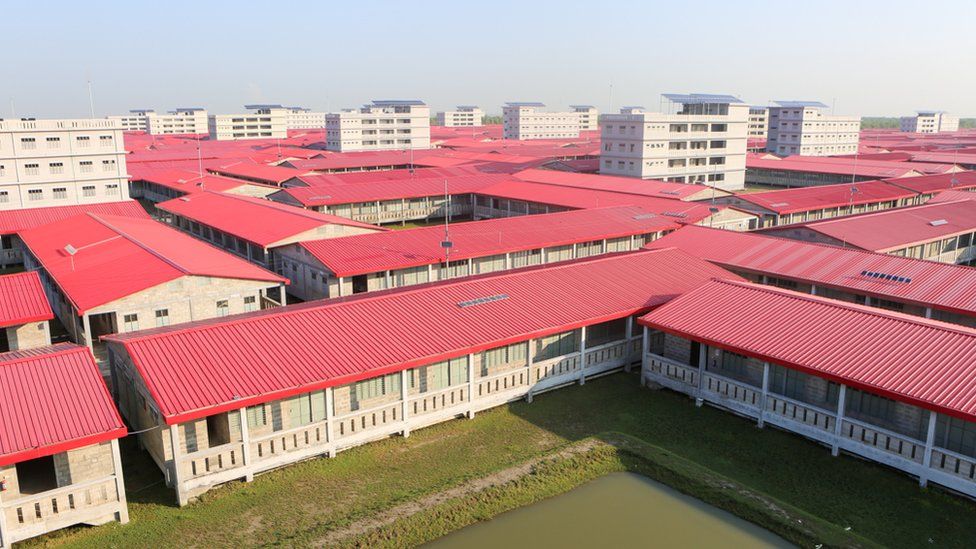 A bird's eye view of the red roofed houses. Started in 2018, a total 1440 homes have been built with adjacent kitchens and bathrooms to be shared between several families