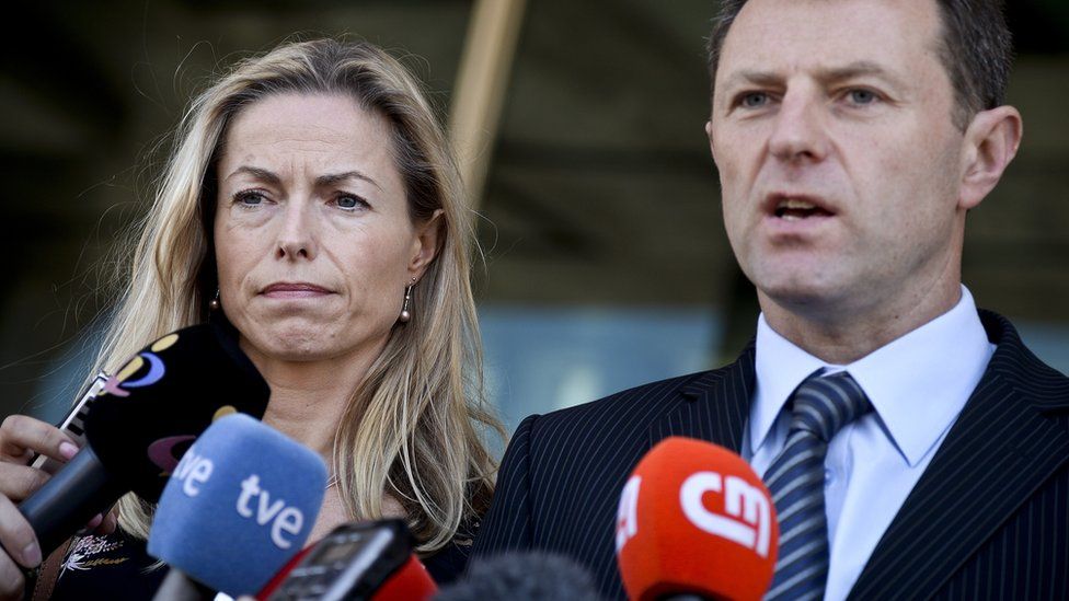 Kate McCann (L) and her husband Gerry McCann (R), talk to the press after delivering statements at the court house in their case against Portuguese police officer Goncalo Amaral, in Lisbon on July 8, 2014.