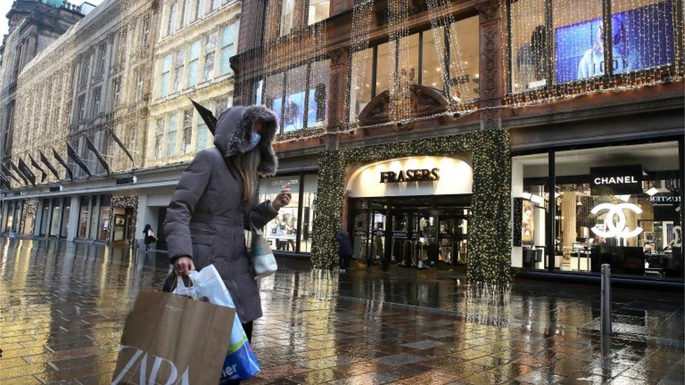 Lone shopper walking in Buchanan Street, Glasgow
