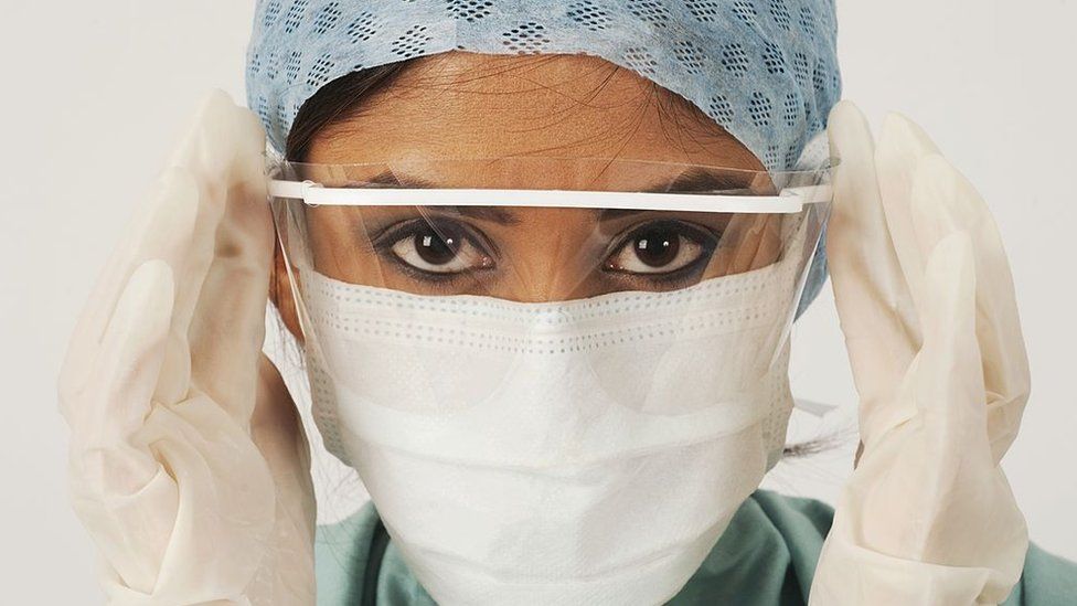 Female medic in a mask