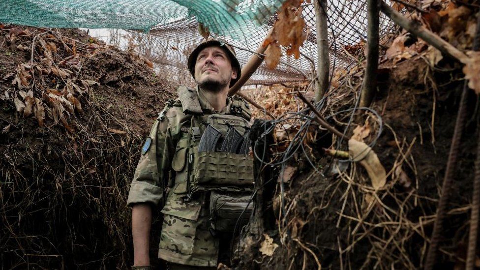 Ukrainian soldier in a trench