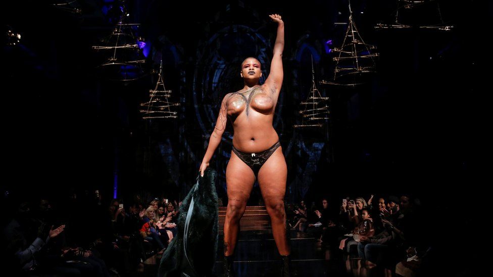 Model Ericka Hart, who had a double mastectomy, stands on the catwalk at New York Fashion Week