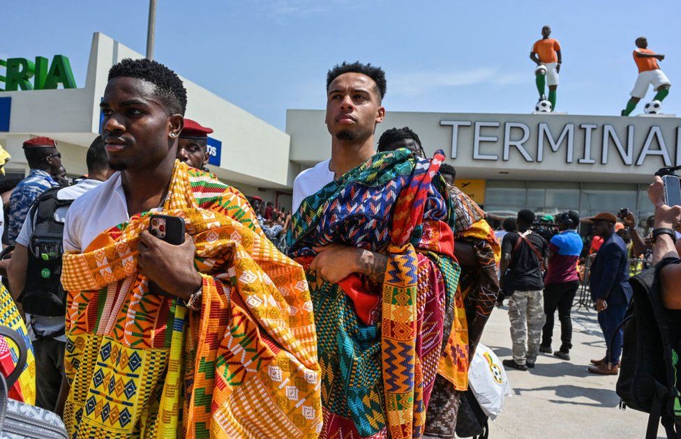 Ghana national football team players exit the Felix Houphouet-Boigny International Airport in Abidjan.