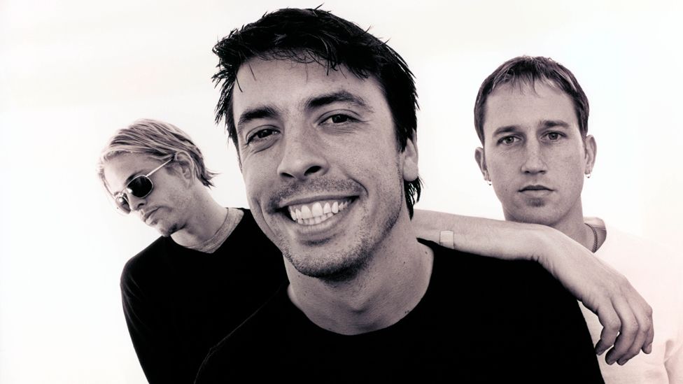 Posed studio group portrait L-R Taylor Hawkins, Dave Grohl and Chris Shiflett, 362