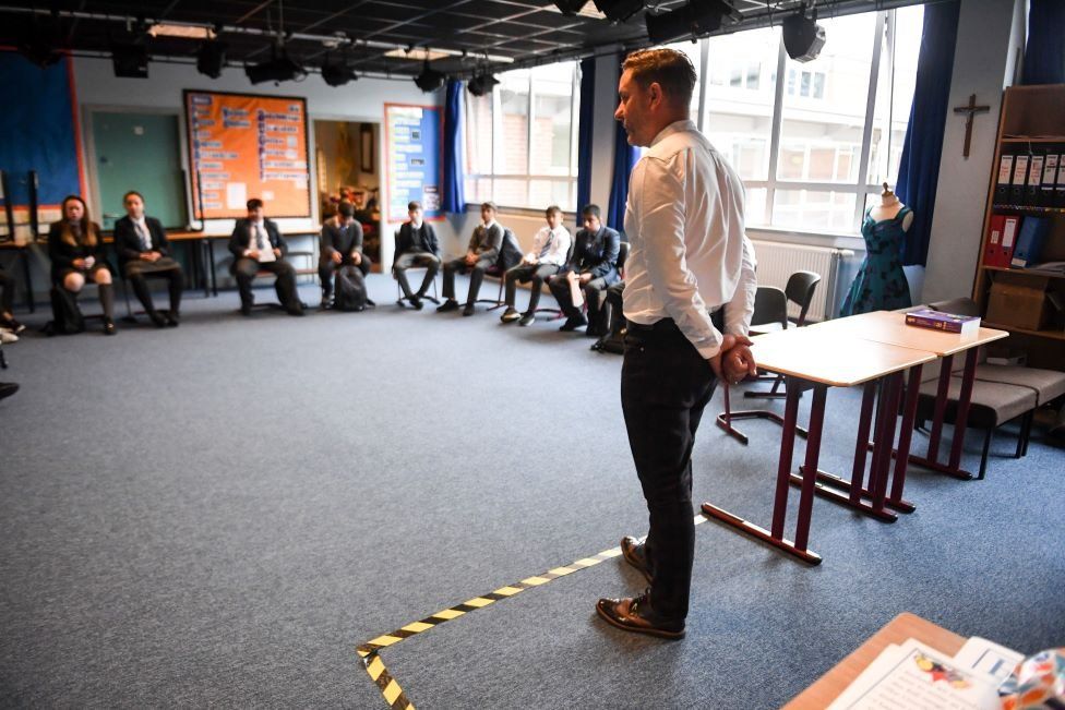 Drama teacher Geoff Nolan gives a socially distanced class to pupils at Holyrood Secondary School in Glasgow for the first time following the easing of coronavirus lockdown measures on August 12, 2020