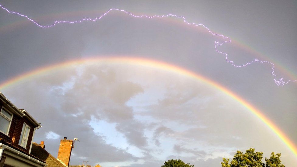 Lightning over a double rainbow