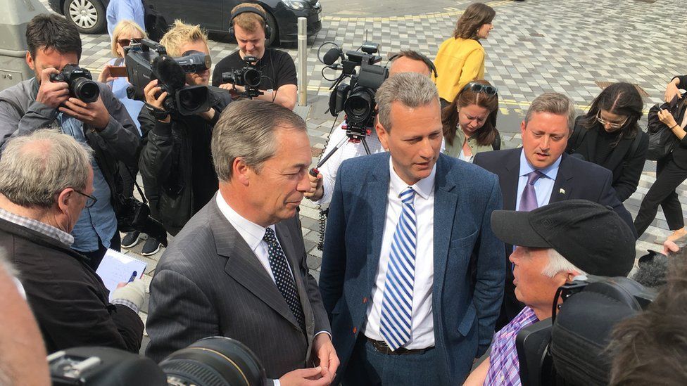 Nigel Farage and Nathan Gill meeting voters in Merthyr Tydfil in May 2019