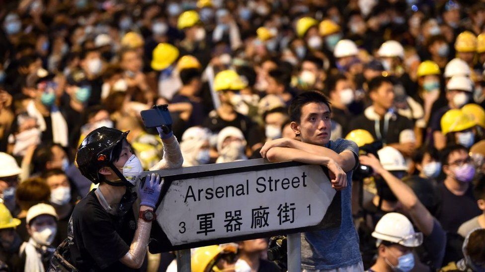 Thousands of protesters converged on Hong Kong's police headquarters on 21 June