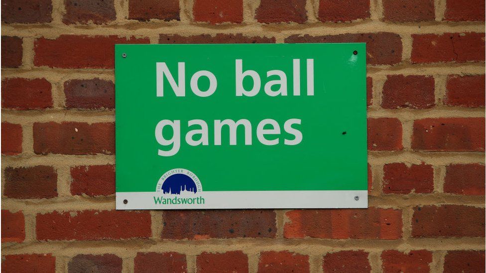 No Ball Games sign in Wandsworth with white letters on a green background