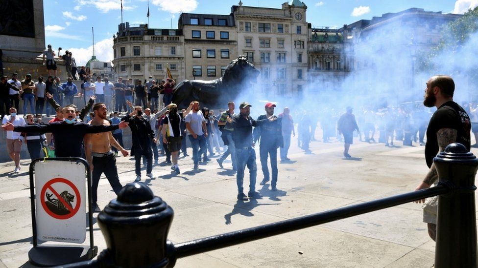 Flares and smoke bombs have been thrown in Trafalgar Square