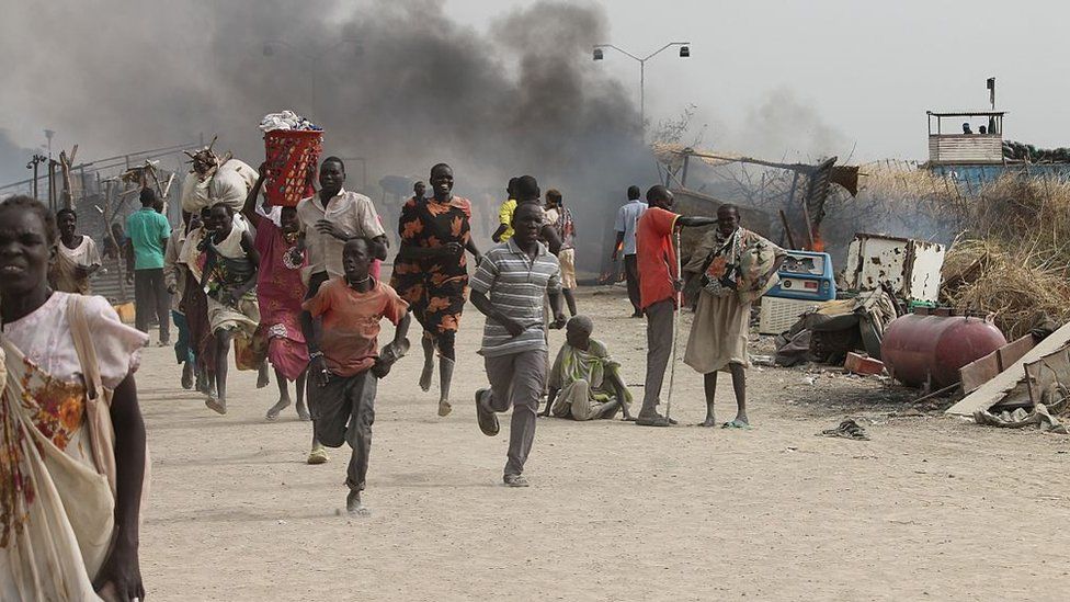 South Sudanese civilians flee fighting in an United Nations base in the north-eastern town of Malakal on February 18, 2016