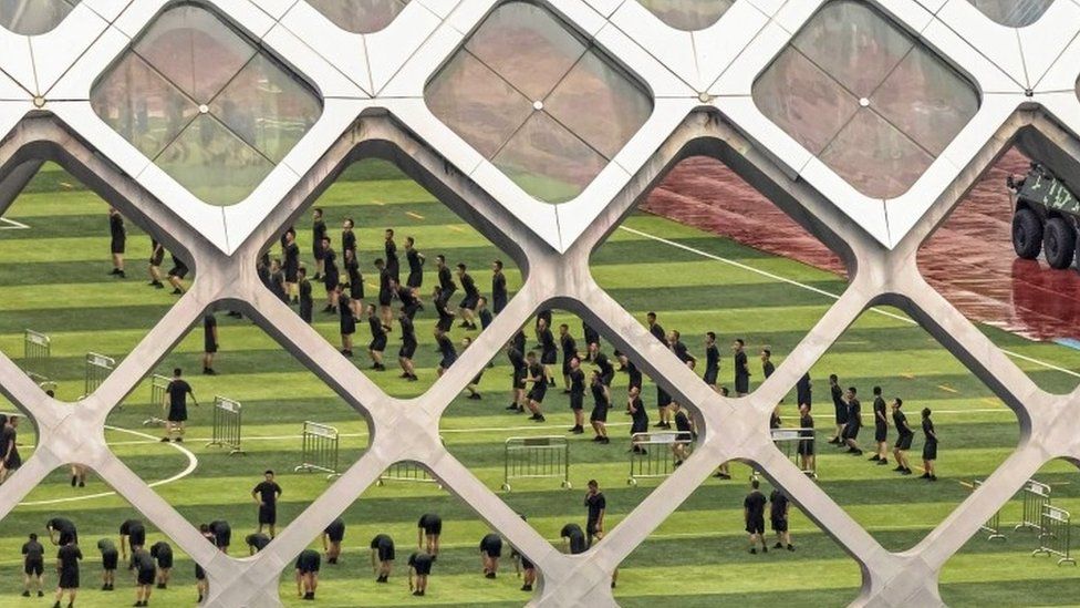 Members of China's People's Armed Police Force (PAP) practice in Shenzhen, near the border with Hong Kong