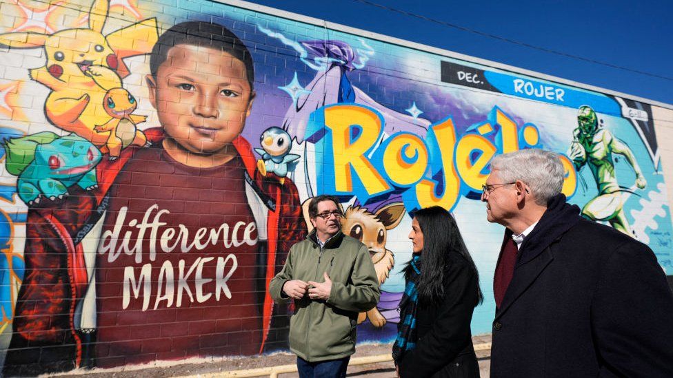 US Attorney General Merrick Garland stands outside of a mural in Uvalde, Texas