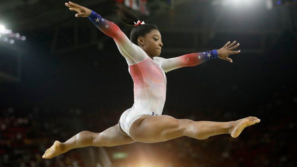 In this Aug. 17, 2016 file photo, United States" Simone Biles performs on the balance beam during the gymnastics exhibition gala at the 2016 Summer Olympics in Rio de Janeiro, Brazil.