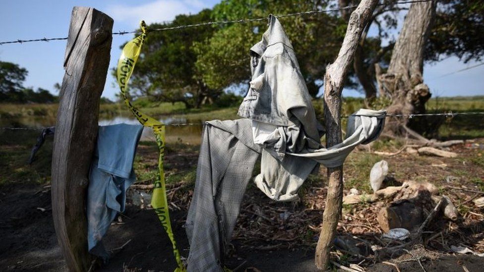 Clothing is pictured on a wire fence at site of unmarked graves where a forensic team and judicial authorities are working after human skulls were found, in Alvarado, in Veracruz state, Mexico, 19 March, 2017