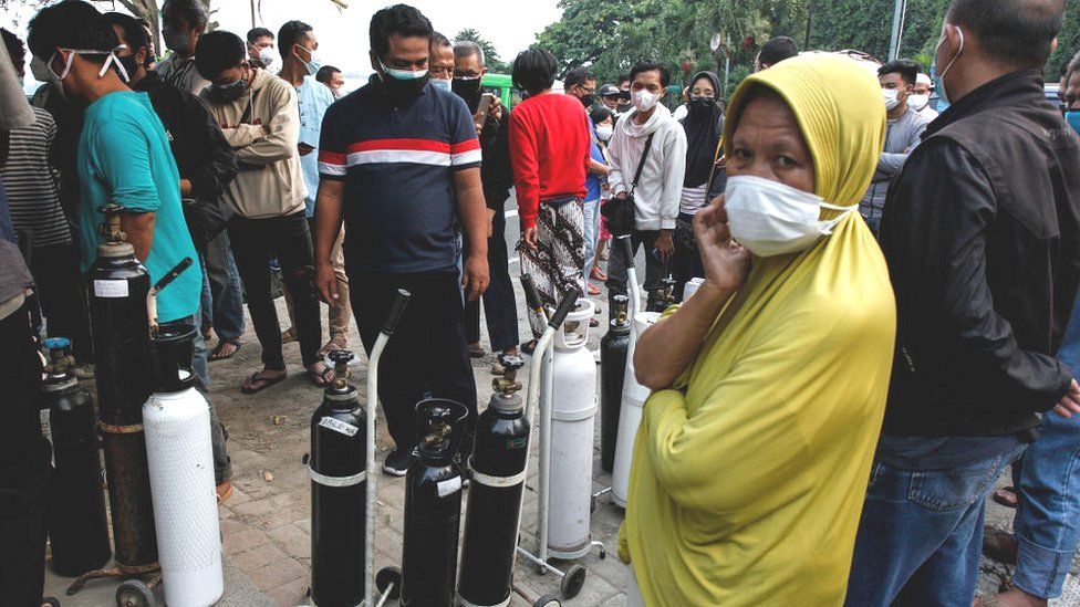 West Java residents with oxygen canisters