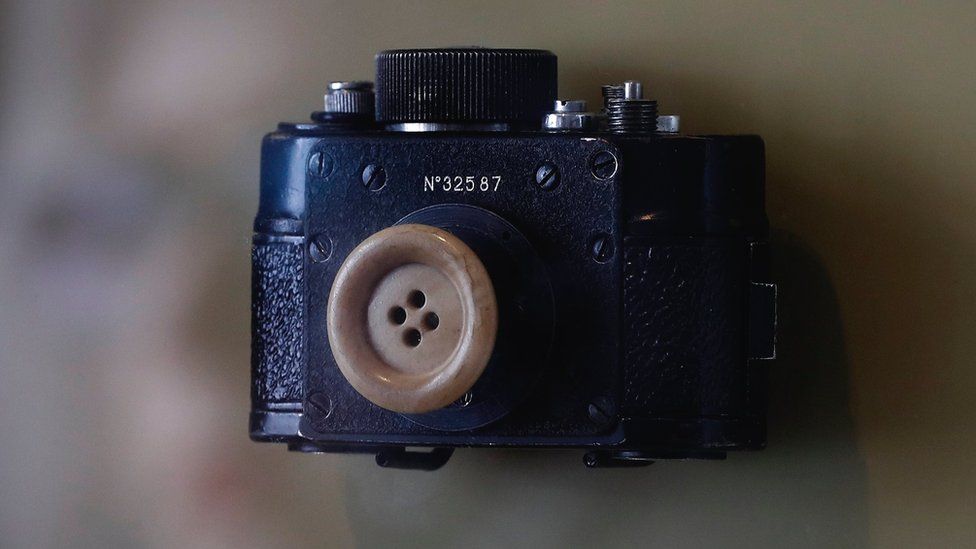 A mini photo camera disguised under a button used by the former Ministry for State Security (Stasi) of the German Democratic Republic (GDR),on display at the Stasi Museum in Berlin, Germany, 21 February 2017
