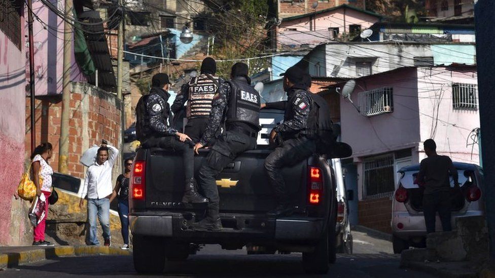 Members of Venezuela's Special Action Forces (FAES) carry out a security operation in Caracas