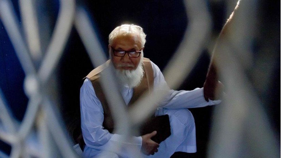 File photograph taken on October 29, 2014, shows Bangladeshi Jamaat-e-Islami party leader Motiur Rahman Nizami as he sits inside a van while being taken to a prison after being sentenced at the International Crimes Tribunal court in Dhaka. Bangladesh's Supreme Court on May 5, 2016