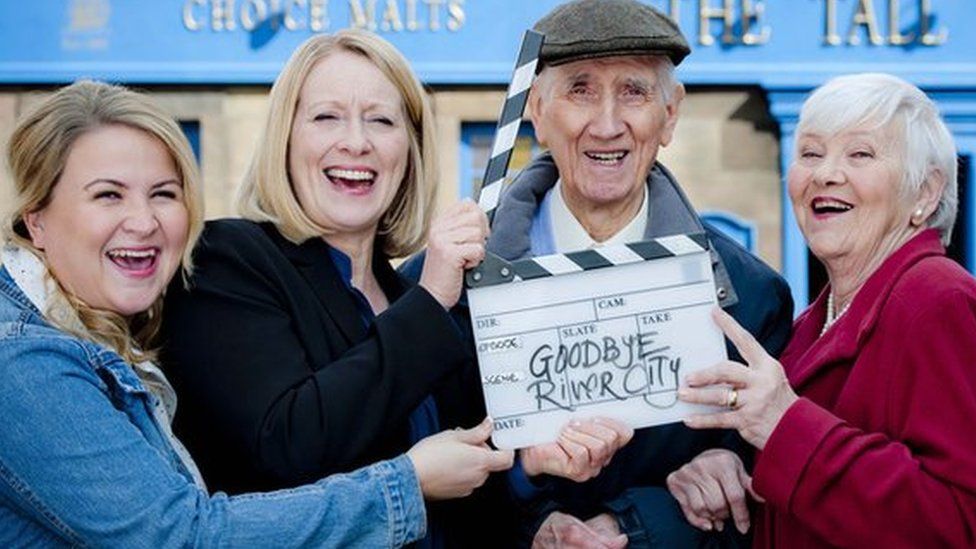 Actor Johnny Beattie with co-stars of River City on his last day of filming.