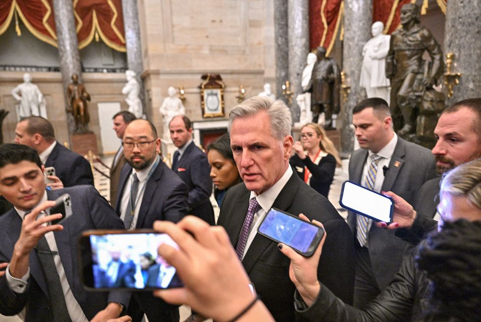 Kevin McCarthy surrounded by phone cameras