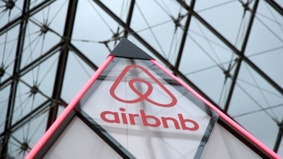 The Airbnb logo is seen on a little mini pyramid under the glass Pyramid of the Louvre museum in Paris, France, March 12, 2019