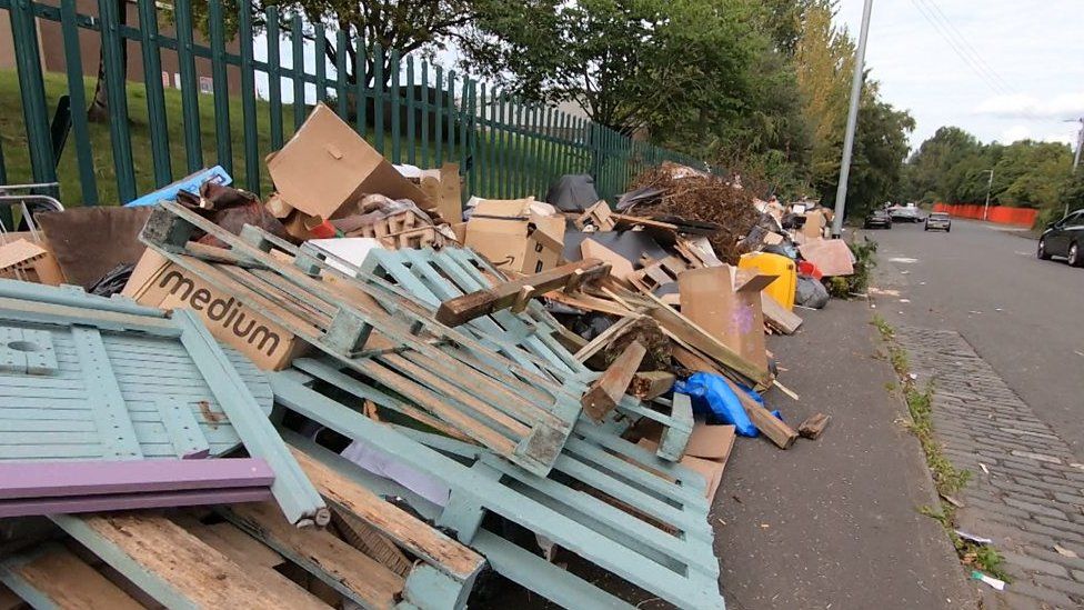 Rubbish outside recycling centre