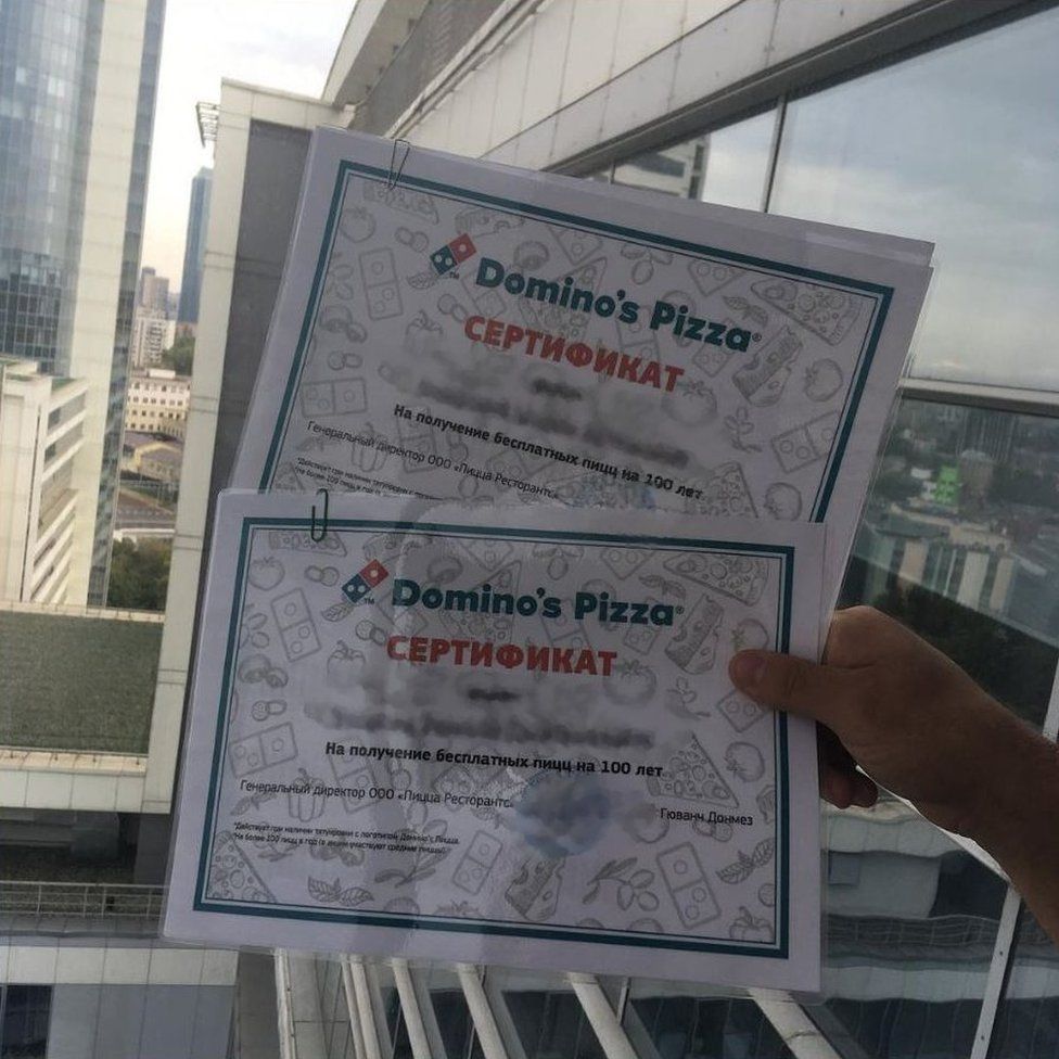 Two certificates in Russian with the Domino's Pizza logo