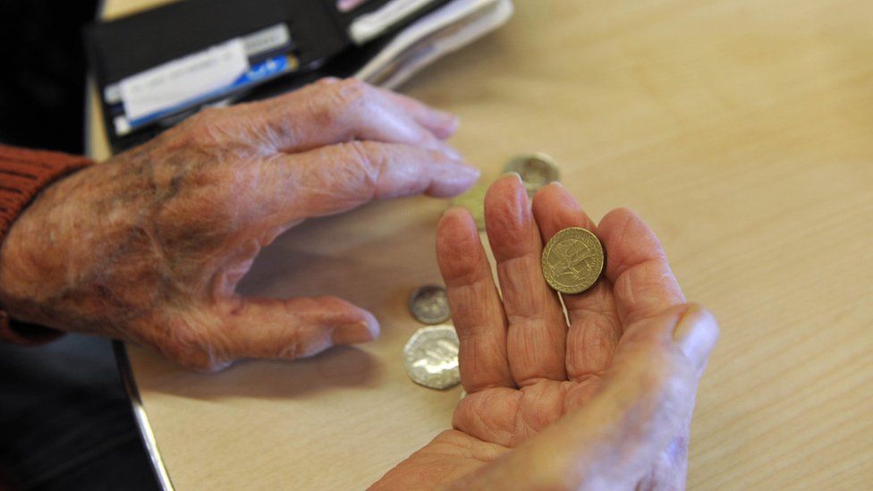 Pensioners' hands and money