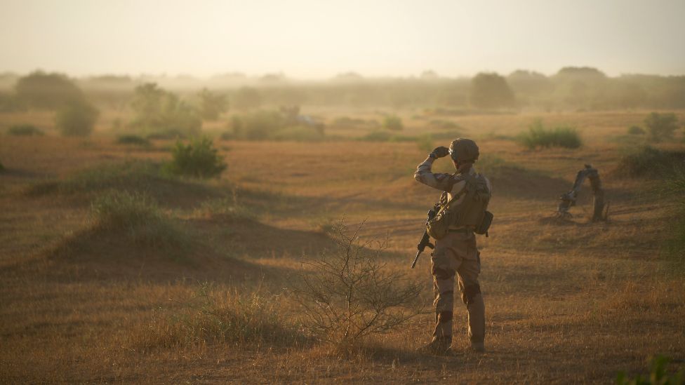 A French soldier monitors a rural area during an operation in northern Burkina Faso, along the border with Mali and Niger, on 10 November 2019
