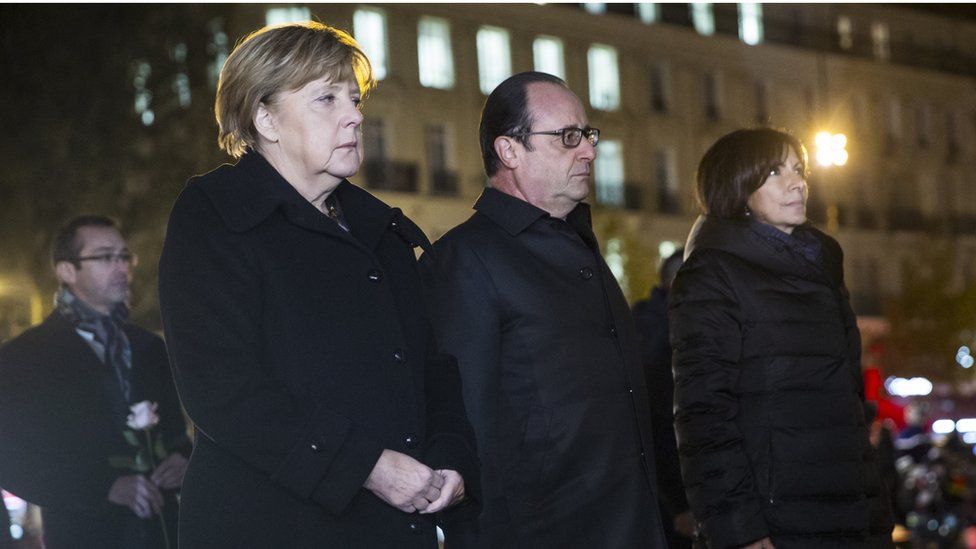 German Chancellor Angela Merkel, French president Francois Hollande and Paris Mayor Anne Hidalgo pay their respects to the victims of the attacks