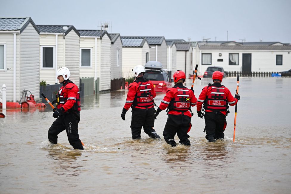 Fire and rescue officers search for people in need of rescue from their holiday chalets at Freshwater Beach Holiday Park, on November 02, 2023 in Burton Bradstock, Dorset.