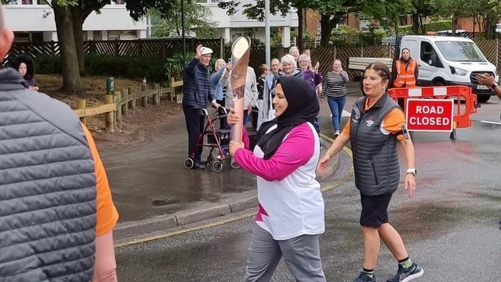 Aminah Shafiq carrying the Commonwealth Games torch