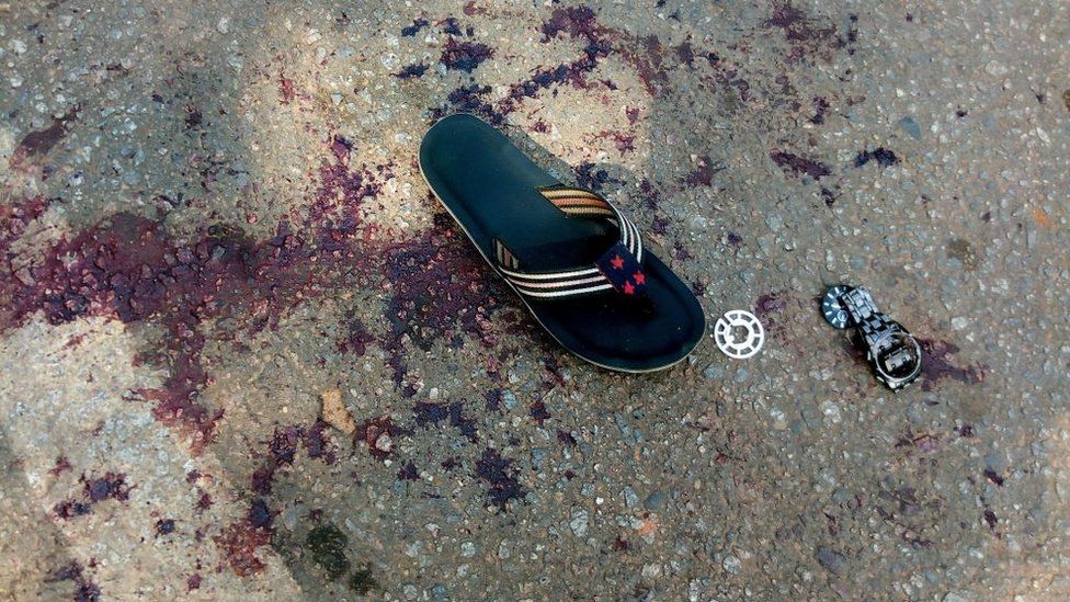 A shoe sits on blood stained floor following the clash between security operatives and supporters of an imprisoned leader of the Islamic Movement of Nigeria (IMN) Ibrahim Zakzaky at the premises of national assembly building in Nigeria's capital Abuja, on July 9, 2019.