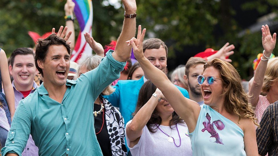 Prime Minister Justin Trudeau and his wife Sophie Gregoire Trudeau (R) at a Vancouver Pride parade
